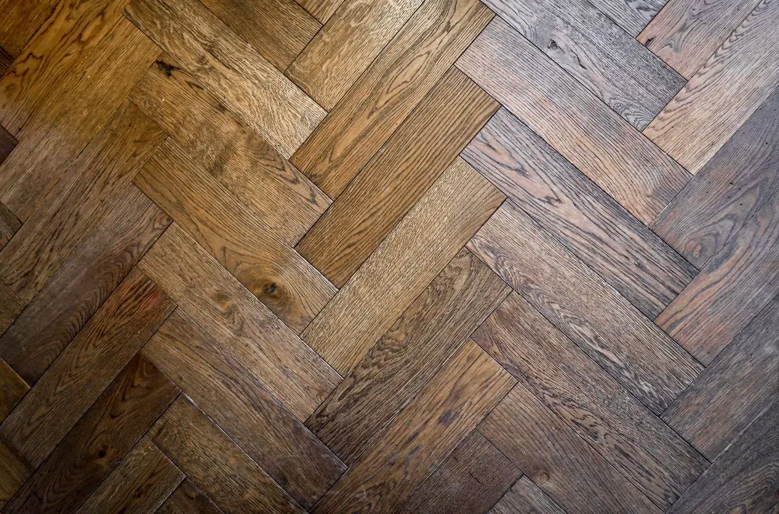 Close-up of herringbone wood-effect flooring