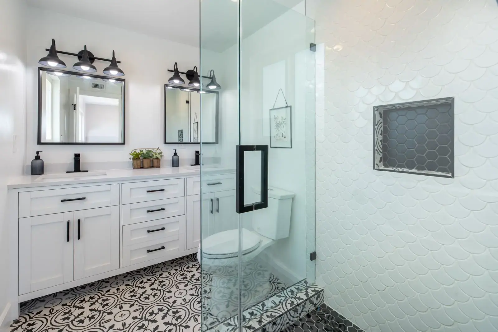 Black and white patterned tile-effect floor in a bathroom